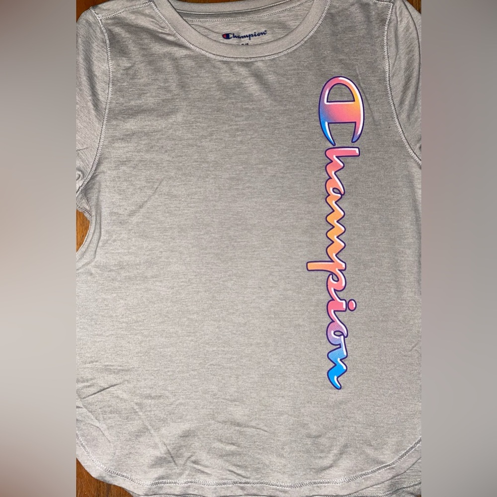 NWOT Champion light gray tee with multicolored Champion up&down side of front.